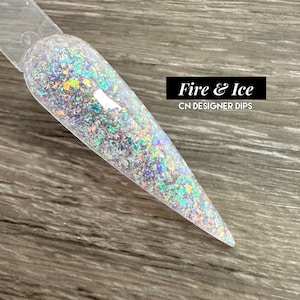May include: A clear nail dip powder with iridescent glitter, labelled "Fire & Ice CN Designer Dips".
