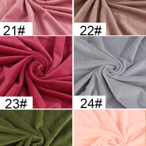 May include: Six fabric swatches in different colors. The swatches are arranged in two rows of three. The colors are pink, brown, red, gray, green, and peach.