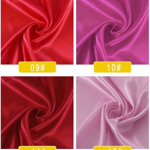 May include: Four fabric swatches in different colours. The top left swatch is a bright red satin fabric. The top right swatch is a bright magenta satin fabric. The bottom left swatch is a deep red satin fabric. The bottom right swatch is a light lavender satin fabric. Each swatch has a yellow label with a number on it. The top left label says "09#", the top right label says "10#", the bottom left label says "11#", and the bottom right label says "12#"