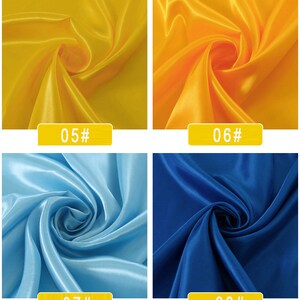 May include: Four fabric swatches in different colours. The top left swatch is yellow, the top right swatch is orange, the bottom left swatch is light blue, and the bottom right swatch is dark blue. Each swatch has a number printed on it: 05#, 06#, 07#, and 08#.