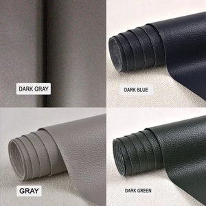 May include: Four rolls of faux leather fabric in different colors: dark gray, dark blue, gray, and dark green. The fabric has a textured surface.