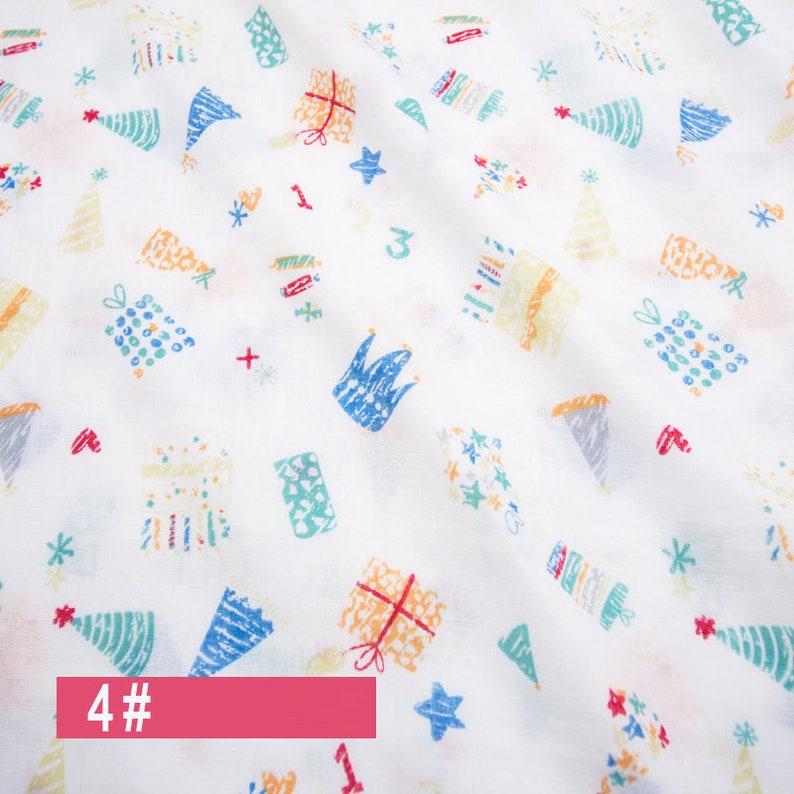 May include: White fabric with a repeating pattern of colourful birthday-themed illustrations. The illustrations include presents, party hats, stars, and crowns. The text "4#" is printed in red at the bottom of the image.