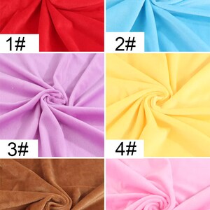 May include: Six fabric swatches in different colors: red, light blue, lavender, yellow, brown, and pink. Each swatch is folded in a spiral shape. The swatches are labeled with numbers 1 through 6.