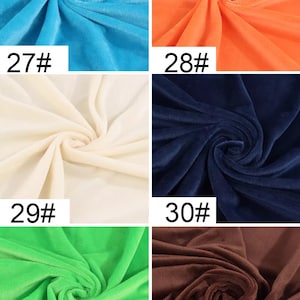 May include: Six fabric swatches in different colors. The swatches are arranged in two rows of three. The colors are turquoise, orange, cream, navy blue, lime green, and brown. Each swatch has a number printed on it, starting with 27 and ending with 32.