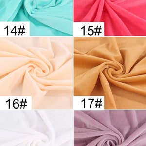 May include: Six fabric swatches in different colors. The swatches are arranged in two rows of three. The colors are turquoise, pink, peach, brown, white, and purple. Each swatch has a number printed on it: 14, 15, 16, 17, 18, and 20.