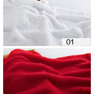 May include: Two fabric swatches, one white and one red. The fabric is soft and fluffy, resembling a plush material. The swatches are labeled "01" and "02".