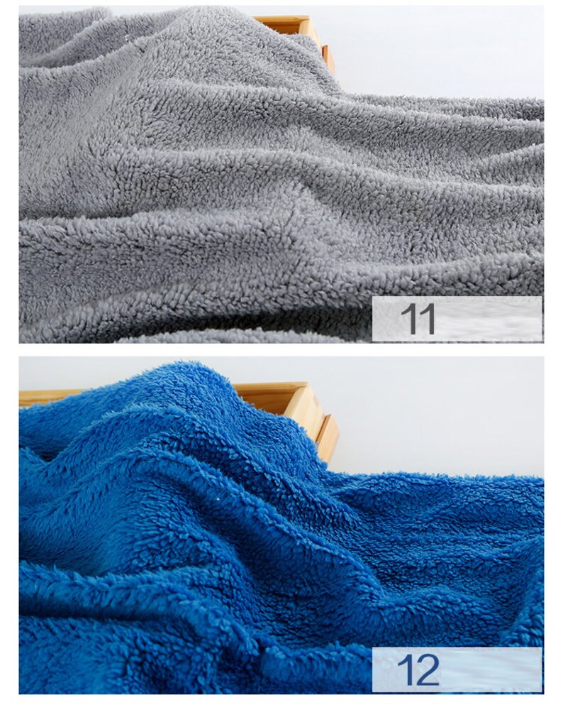 May include: Two fabric swatches, one gray and one blue, are shown on a wooden surface. The swatches are soft and fluffy, with a fuzzy texture. The number "11" is written on a white label below the gray swatch, and the number "12" is written on a white label below the blue swatch.