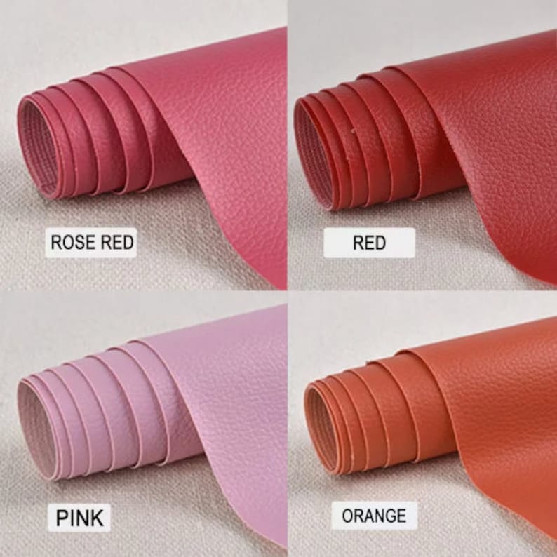 May include: Four rolls of faux leather in different colors: rose red, red, pink, and orange. The leather has a textured surface.
