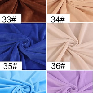 May include: Six fabric swatches in different colors. The swatches are arranged in two rows of three. The colors are brown, beige, blue, beige, light blue, and purple. Each swatch has a number printed on it: 33, 34, 35, 36, 37, and 38.