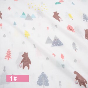 May include: White fabric with a repeating pattern of brown bears, trees, mountains, and stars. The fabric has a light pink label with the number "1#" on it.