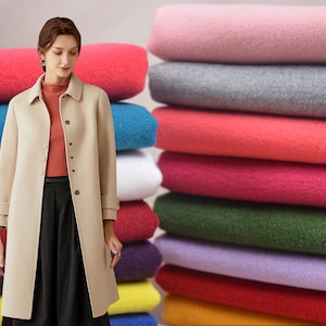 May include: A stack of colorful fabric swatches in various shades of pink, red, green, purple, and blue. The fabric is soft and plush, perfect for crafting or sewing projects.