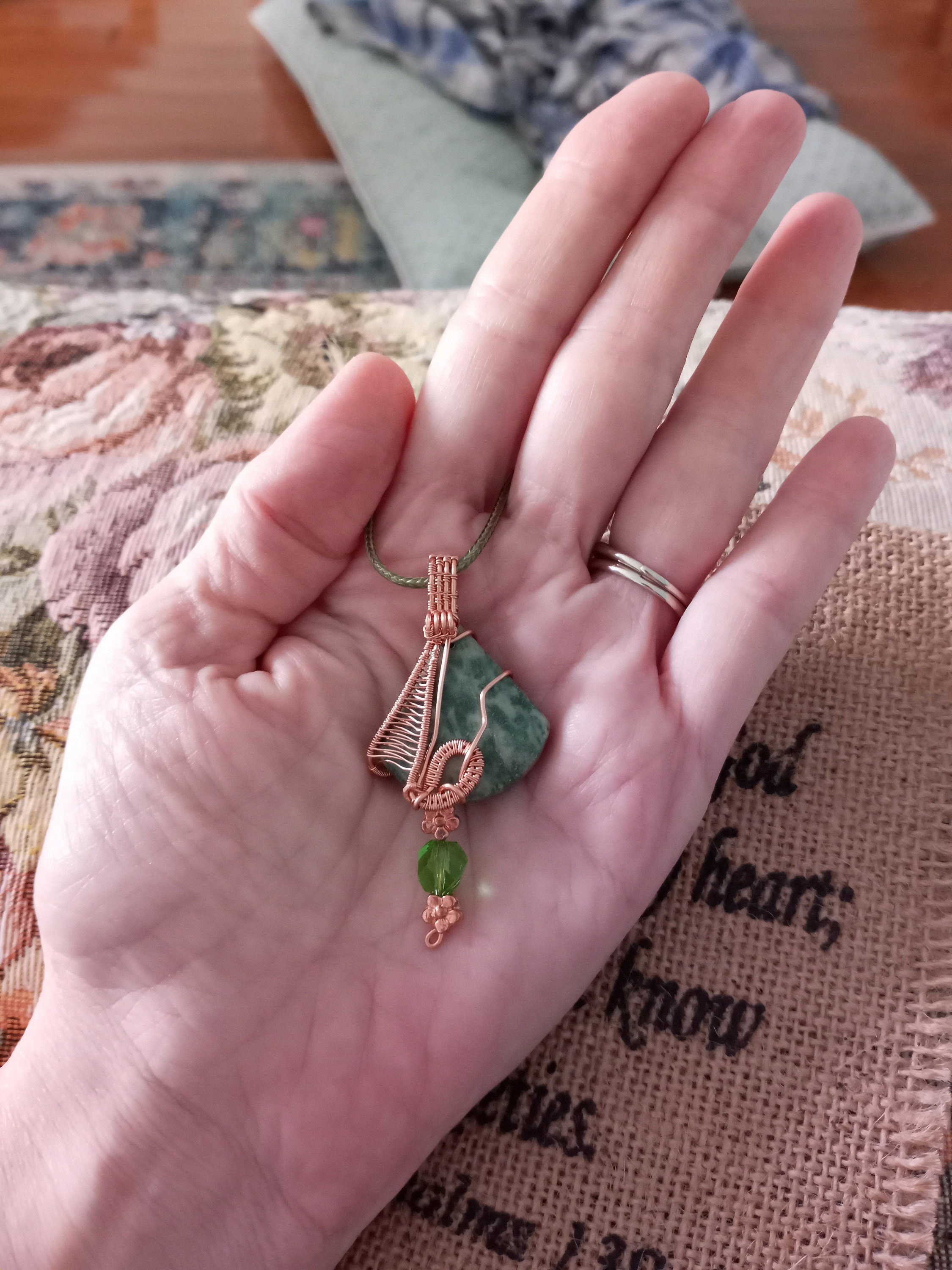 supplied with cord necklace Lovely green triangular stone pendant hand wrapped in woven copper wire