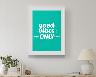 May include: A white framed print with a turquoise background and the text "good vibes only" in white lettering.
