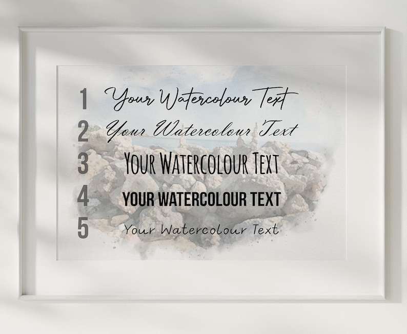 May include: A framed print featuring a watercolor-style image of a rocky shoreline. The text 'Your Watercolour Text' is displayed in five distinct black fonts, each numbered one through five, arranged vertically over the rocky landscape.