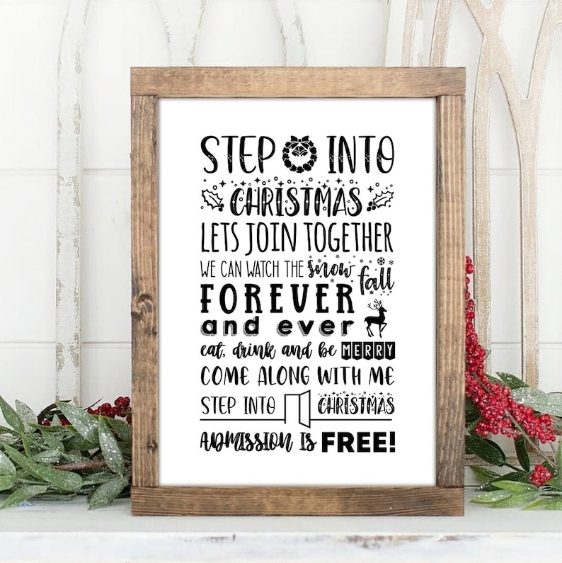 May include: A black and white sign with a rustic wood frame that reads "Step into Christmas, Let's join together, we can watch the snow fall forever and ever, eat, drink and be merry, come along with me, step into Christmas, admission is free!"