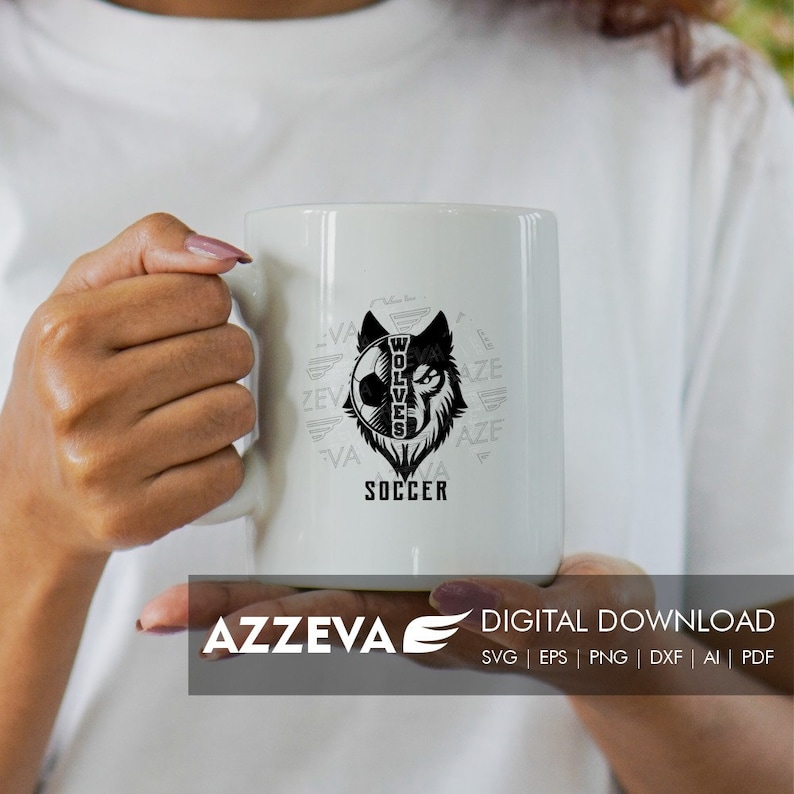 May include: White ceramic mug with a black and white graphic of a wolf's head with a soccer ball inside. The text "WOLVES" is inside the wolf's head and the text "SOCCER" is below the wolf's head. The text "VA" and "AZE" are repeated around the wolf's head.