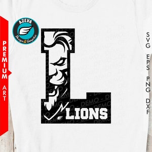 May include: Black and white graphic design of a lion's face inside the letter L with the word "LIONS" below. The design is on a white t-shirt.