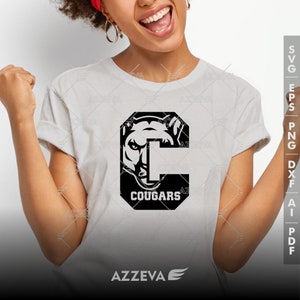 May include: A white t-shirt with a black graphic of a cougar's head inside a letter C. The text "Cougar" is below the graphic.