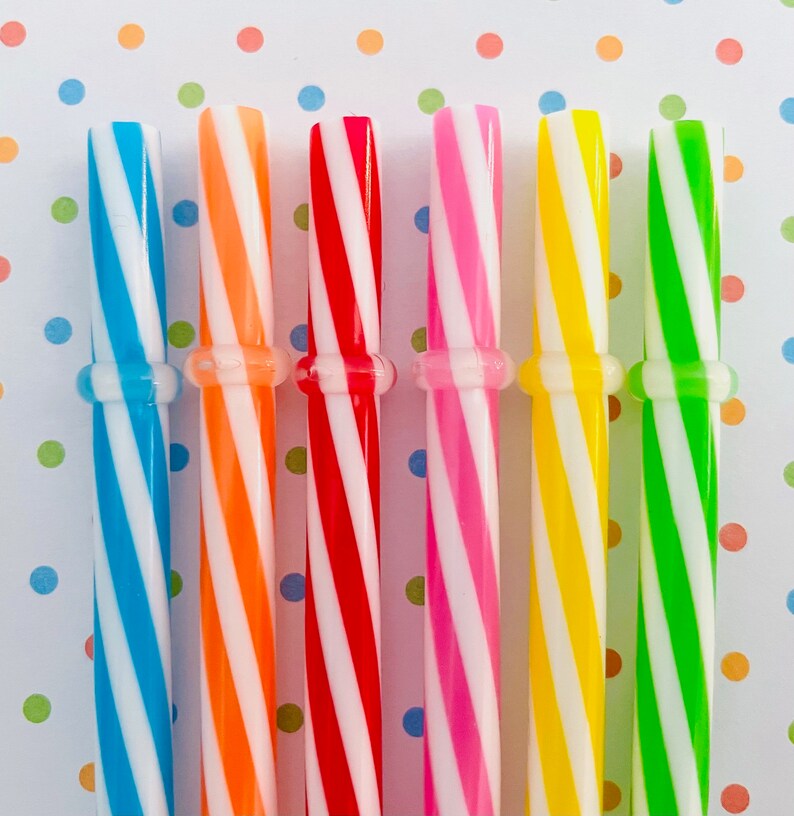 May include: Six striped drinking straws in different colors: blue, orange, red, pink, yellow, and green. The straws are all the same size and have a white stripe.