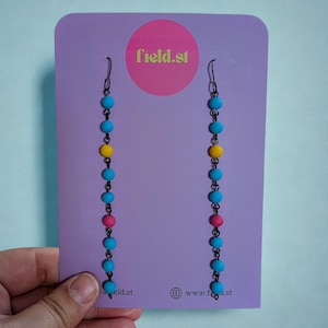 Long beaded blue pink and yellow dangle earrings