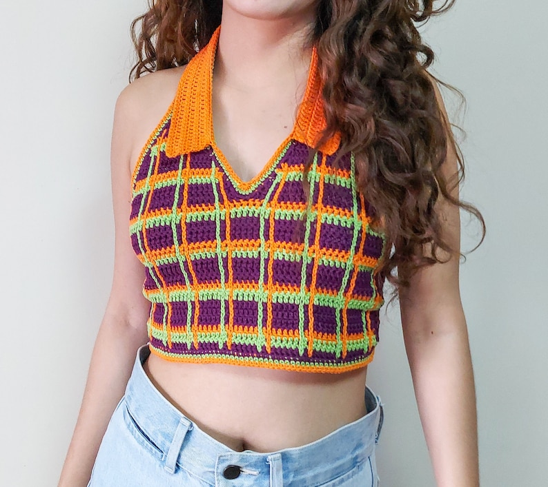May include: A purple, green, and orange plaid crochet halter top.