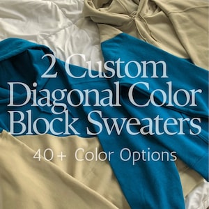 May include: Two custom diagonal color block sweatshirts in teal and beige. The text "2 Custom Diagonal Color Block Sweaters 40+ Color Options" is printed on the sweatshirts.