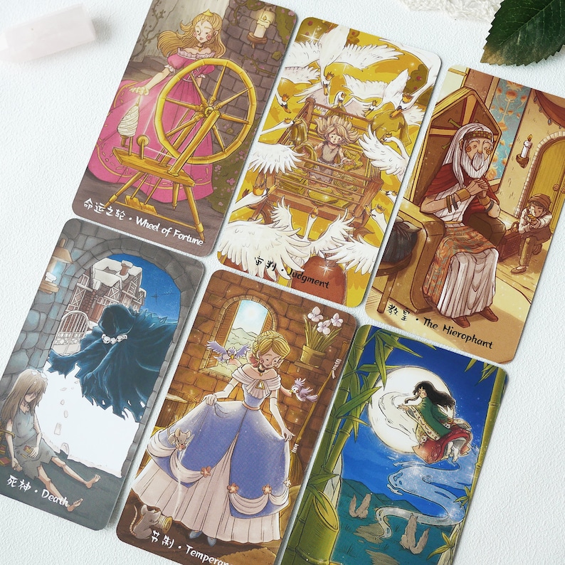 May include: A set of ten tarot cards with colorful illustrations and Chinese characters. The cards feature a variety of scenes, including a woman spinning a wheel, a woman in a cage, a man sitting on a throne, a woman in a blue dress, and a woman flying through the air.