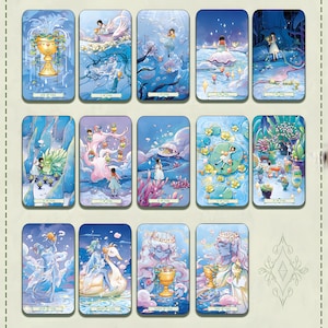 May include: A collection of tarot cards featuring watercolor illustrations in shades of blue, gold, and pink. Each card depicts a unique scene with figures, cups, and natural elements. The cards are arranged in rows, showcasing the detailed artwork and mystical themes.