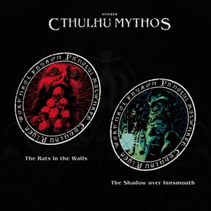 May include: Two round stickers with black and white text and images. The first sticker is red and features a creature with a mouth full of skulls. The text reads "WGARDAGL FH5AGN PANGLUI MGLWNAFD CTHULHU R'LYEH". The second sticker is green and features a creature with a large mouth and sharp teeth. The text reads "WGARDAGL FH5A&sigma;&eta; &Rho;ήngs MG LW NAFP CTHULHU R'LYEH".