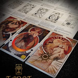 May include: Tarot card deck with art nouveau illustrations. The cards show figures with celestial elements, including the moon and sun. The deck includes the text "Tarot The Forest Knows".