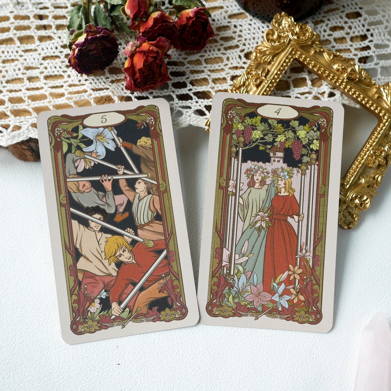May include: Two tarot cards, one with the number 5 and the other with the number 4. The card with the number 5 shows a group of people with swords, while the card with the number 4 shows two women in long dresses.