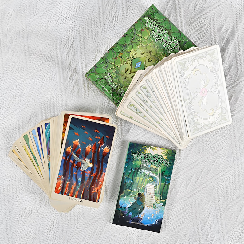 May include: A tarot card deck with a green box and a small booklet. The cards feature colorful illustrations, including one labeled "8 of Wands." The box and booklet have the text "Forest Spirit Imprints."