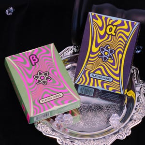Light Factor Playing Cards Glow-in-the-Dark Cardistry Decks UV Fluorescent Ink Neon Colors Geometric Designs Black Core Air-Cushioned Finish