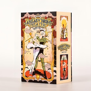 May include: A tarot card box with the words "Fantasy Night Theater" and illustrations of dancers. The box features a ballet-themed design with a couple dancing, and additional tarot card images on the side.
