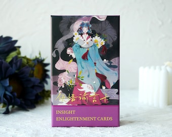 May include: A deck of Insight Enlightenment Cards with a purple background and gold lettering. The front of the box features a colorful illustration of a woman in a blue and white robe holding flowers.