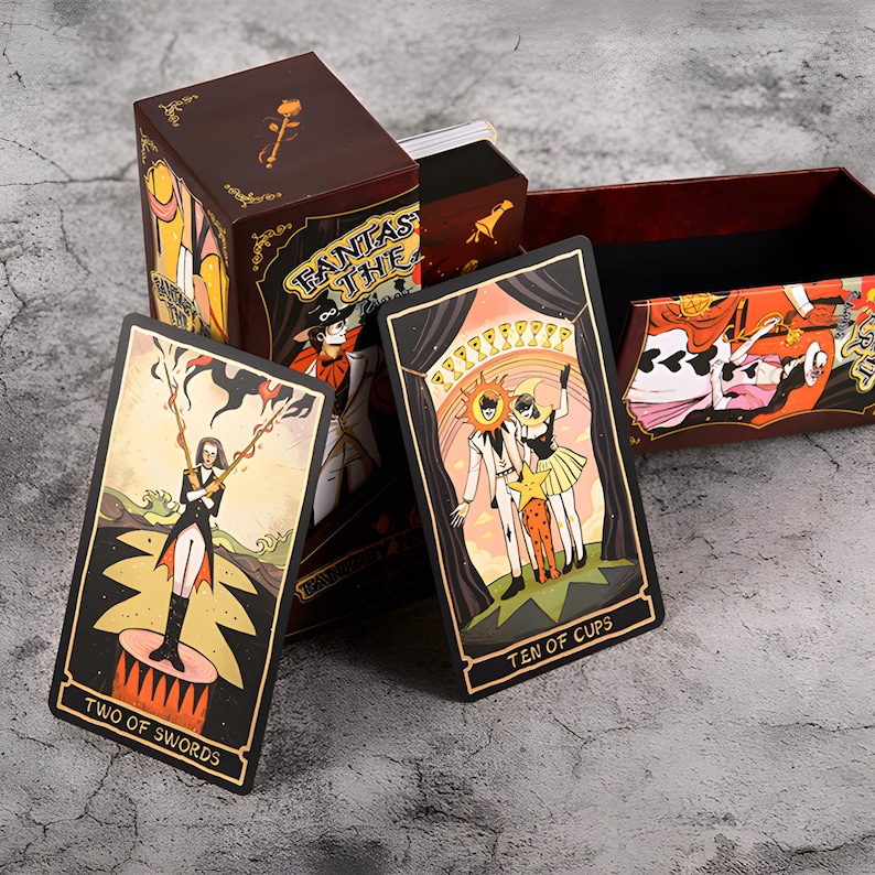 May include: A tarot card deck with a burgundy box featuring the text "Fantasy Tarot". The cards display colorful illustrations, including "Two of Swords" and "Ten of Cups". The box and cards have a vintage aesthetic.