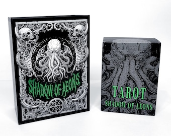 May include: A black tarot card box and deck featuring a detailed illustration of a creature with tentacles, skulls, and the text "SHADOW OF AEONS" and "TAROT". The design is in shades of gray and green.