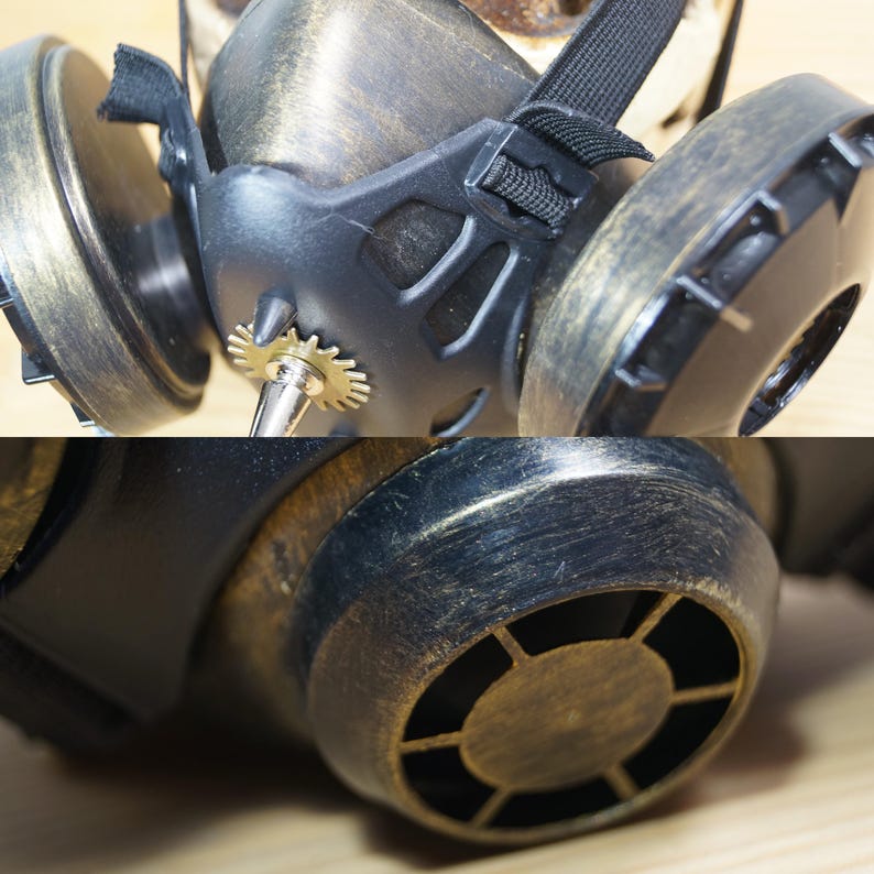 May include: A steampunk-style gas mask with a brass finish and a gear detail. The mask has a black strap and a black and brass filter.