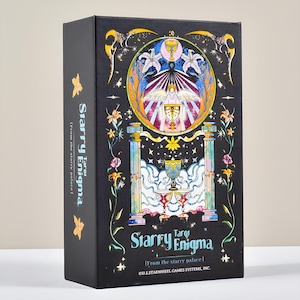 May include: A black tarot card box with the title "Starry Enigma" in white and blue. The box features a colorful illustration of a chalice, angel, and floral elements. The text "From the starry palace" is also visible.