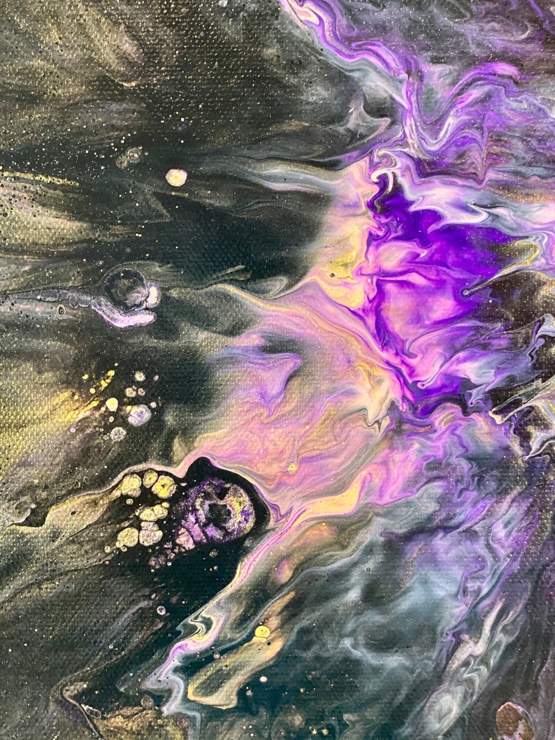 May include: Abstract painting with swirling purple, gold, and black paint. The colors blend together to create a galaxy-like effect.