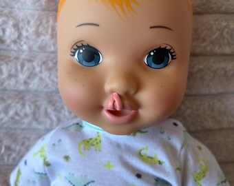 One-of-a-Kind Baby Doll with Cleft Lip, Red Hair, Dinosaur Outfit