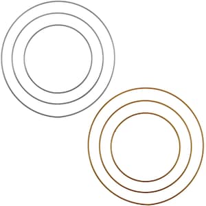 May include: Three metal hoops, one silver and two gold, for crafting wreaths or other decorative projects.