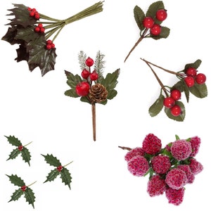 May include: Assortment of artificial Christmas greenery sprigs with red berries.  The sprigs include holly, pine, and berry clusters.