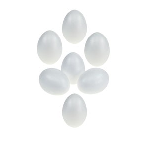 May include: Seven white foam eggs, arranged in a flower shape, isolated against a white background.