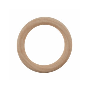 May include: A single, light-coloured wooden ring. The ring is circular with a smooth, unvarnished surface. The wood grain is visible, and the ring appears to be made from a solid piece of wood. The background is plain white.