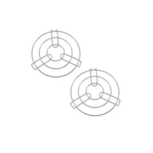May include: Two silver metal trivets. Each trivet has a circular design with three concentric rings and a central support. The trivets are designed to protect surfaces from hot cookware.