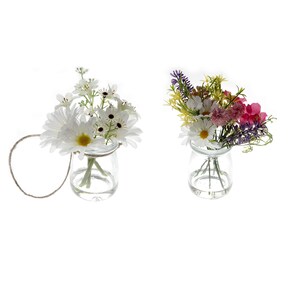 May include: Two glass jars with floral arrangements. The jar on the left has a white daisy bouquet with a brown twine handle. The jar on the right has a mixed bouquet of purple, pink, and yellow flowers.