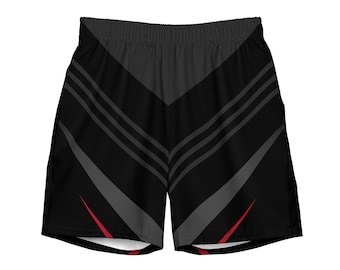 Puede incluir: Shorts deportivos negros con un patrón geométrico gris y rojo.