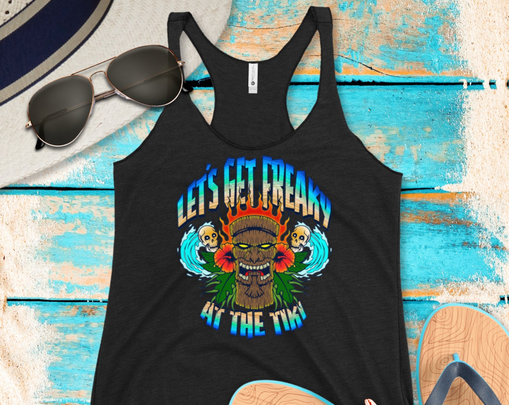 Discover Let's Get Freaky At The Tiki Women's Racerback Tank Top