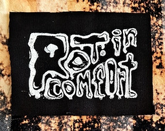 Rot in comfort slijmerige korst punkpatch met print